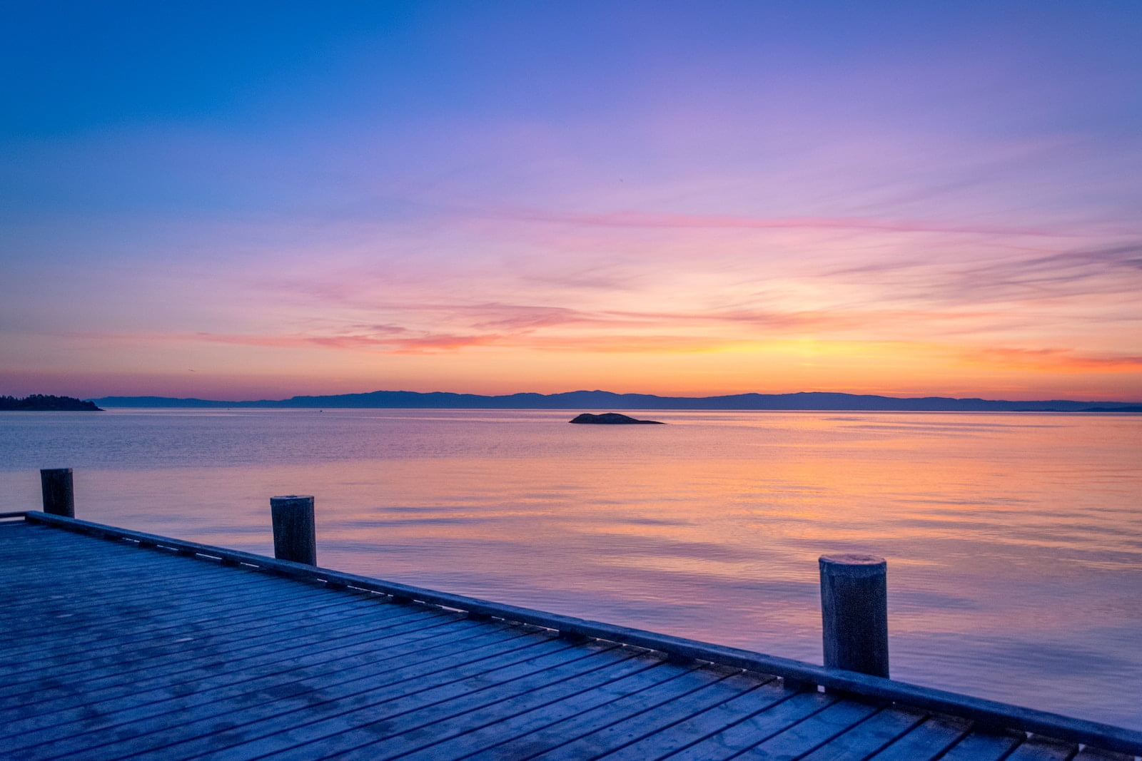 gray wooden dock during golden hour